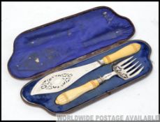 A stunning silver & Ivory handled hallmarked Victorian carving set bearing marks for Harrison &