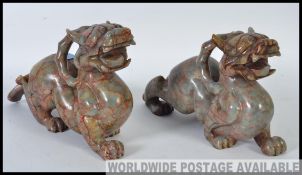 A striking pair of 19th century large sized Chinese oriental carved agate stone temple dogs.