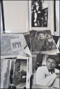 A box of assorted old film stills and lobby cards, headshots, various music / film and TV related.
