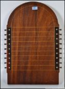 A fabulous early 20th century mahogany inlaid shove ha'penny board having stunning articulated