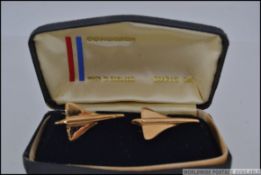 A pair of gold plated Concorde gents cufflinks. In the original presentation box.