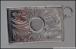 A silver stamp case marked 925 4 cm L 14.