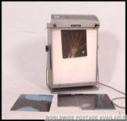 A fabulous mid century industrial enamel painted x-ray light box complete with an x-ray of a hand