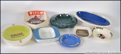 A collection of retro advertising ashtrays, to include Piper, Charles Kinloch, Martell, Fremlins,
