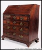 A 19th century Georgian mahogany bureau having a fully appointed interior within fall front slope.