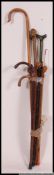 A collection of 20th century walking sticks to include blackthorn,