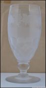 A 19th century acid etched lead / heavy glass celery glass raised on circular base with etchings