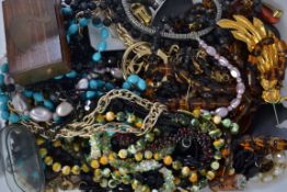 A box of costume jewellery to include necklaces, beads, rings,