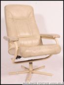 A retro 1970's white leather and tubular metal swivel armchair.