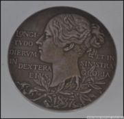 A large 1837 - 1897 Victoria Diamond Jubilee medallion / coin with bust of Queen Victoria inscribed