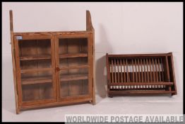 A 20th Century pine wall cupboard of useful proportions with twin glazed doors along with a vintage