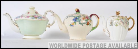 A collection of three teapots to include ones by Aynsley in the Poppy pattern,