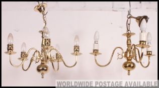 Two traditional reproduction brass chandeliers, one with 3 lights the other with 5 lights.