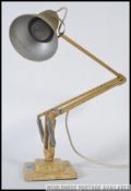 A vintage original Herbert Terry angle poise lamp with a two step base.