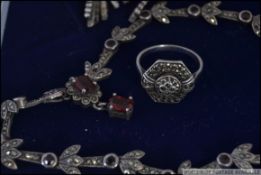 A continental stamped 800 silver and marcasite jewellery set consisting of a ring,