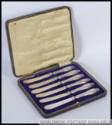 A cased set of silver handled hallmarked fruit knives, with an assay mark for Sheffield,