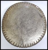 A late 19th / early 20th century brass on copper Indian / Asian brass wall charger.