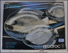 Retro vintage glass fish serving plate accompanied by six matching dinner plates.