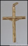 A large 375 9ct gold crucifix pendant Marked 375. Weight 2.1g.