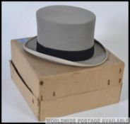 Moss Bros. Gents top hat in original box. To fit head size 7 1/4.