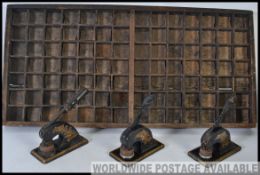 A 19th century printers sectional tray along with three Victorian letter stamps