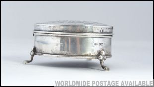 A silver trinket box on hoof feet with Birmingham hallmarks 1908 makers Joseph Gloster.