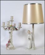A Lladro porcelain figurine lamp of a girl in nightgown with candlestick together with a Dresden