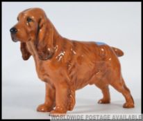 A royal Doulton figure of a Cocker Spaniel ' Lucky pride of ware ' HN1186 issued in 1937 and