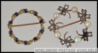 A 9ct gold diamond and pearl brooch of round form.