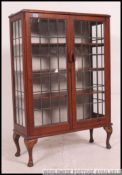 A good quality 1930's honey oak leaded glass display cabinet.
