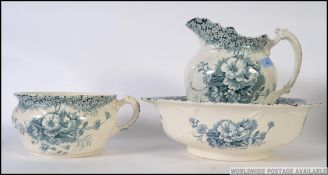 A late 19th early 20th Staffordshire wash bowl and matching jug set along with a bed pan,