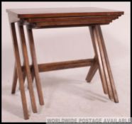 A stunning 1970's teak wood graduating nest of tables,