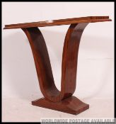 An Art Deco style console hall table of rectangular form having serpentine supports to the