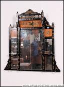 A Victorian Aesthetic movement overmantel mirror having stencilled floral design with back plate