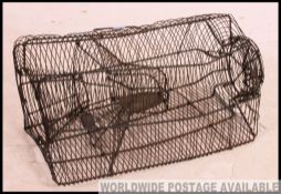 An unusual early 20th century wirework squirrel catcher.