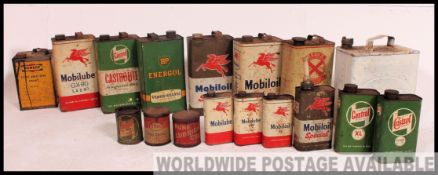 A good collection of oil and fuel cans - industrial advertising and display to include an Esso