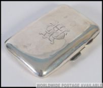 An early 20th century silver hallmarked cheroot / cigarette holder having o monogram to the centre