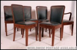 A set of 6 early 20th century Air Ministry style leather dining chairs.