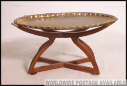 A contemporary good quality brass and mahogany side table.