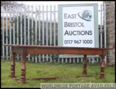 A large mid 19th century Victorian oak refectory table with block and turned legs.
