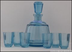 A mid century retro blue glass decanter together with the matching 6 shot glasses H19cm