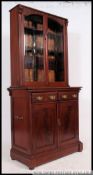 A Victorian style mahogany library boookcase cupboard.