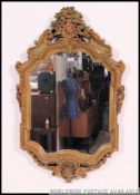 A stunning early 20th century large continental wall mirror of barbola style with handpainted