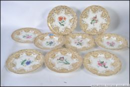 A collection of 19th century Davenport ceramic dinner plates having yellow ground borders with gilt