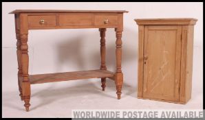 A Victorian pine washstand raised on turned legs with the rectangular top having bowl recess.