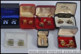 A collection of six sets of cased gentlemans cuff - links and tie pins to include Thomas Nash,