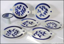 A collection of Scandinavian blue and white fish plates by Arabia being stamped to verso W30cm