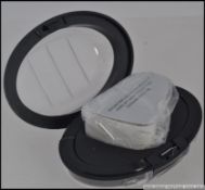 A cased folding Pocket Magnifier Jeweler loupe,