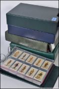 A collection of four albums all containing cigarette cards,