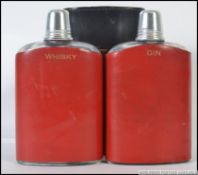 A vintage twin cased leather hip flask,